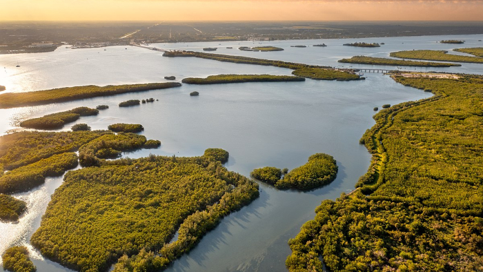 An aerial image of the Indian River Lagoon at sunset.
